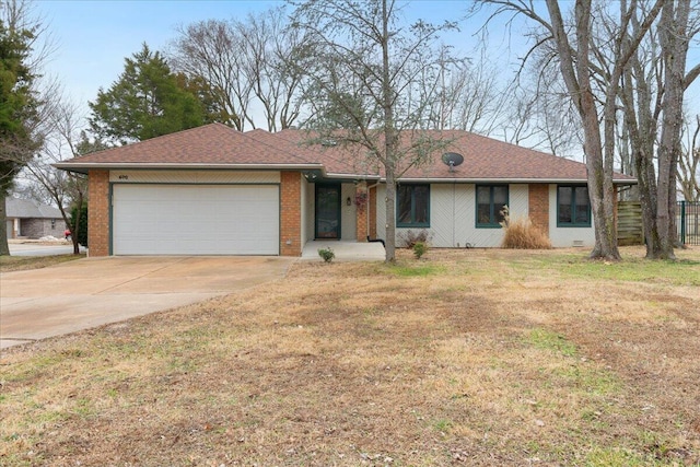 single story home with a garage and a front yard