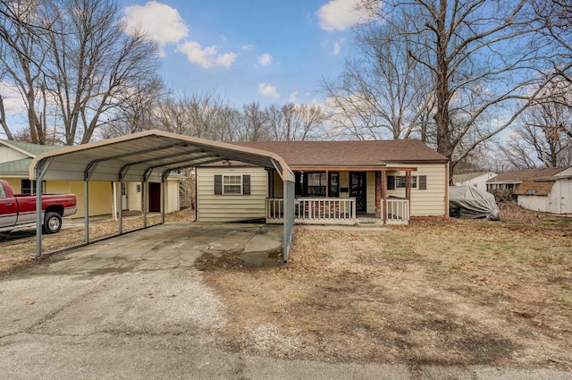 ranch-style house with a porch and a carport