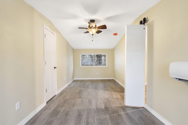 spare room with hardwood / wood-style floors and ceiling fan