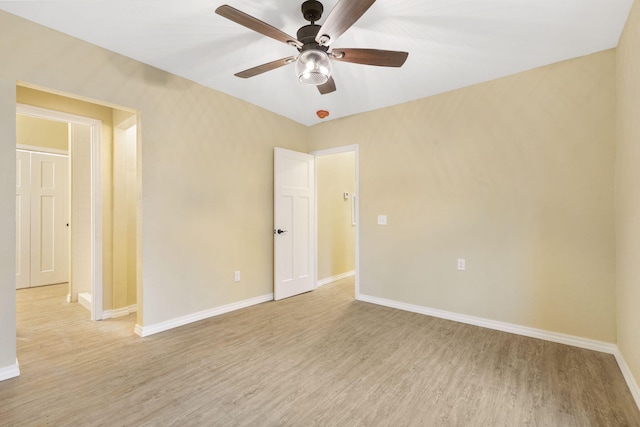 spare room featuring ceiling fan and light hardwood / wood-style flooring