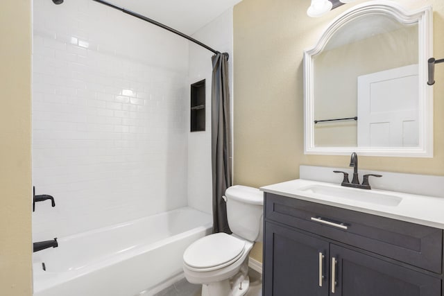 full bathroom featuring vanity, shower / tub combo, and toilet