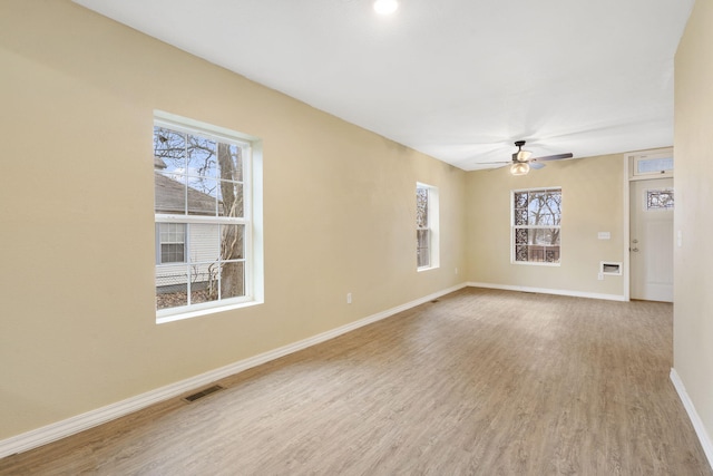 spare room with ceiling fan and light hardwood / wood-style flooring