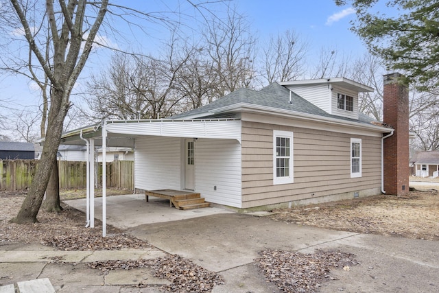 exterior space with a carport