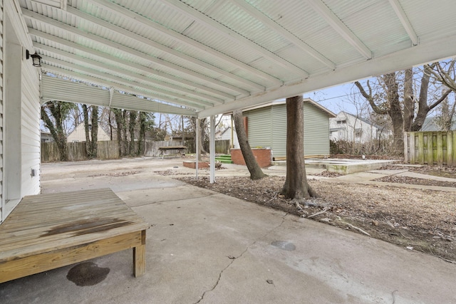 view of patio featuring a shed