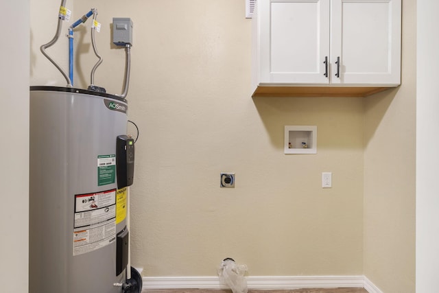 clothes washing area with cabinets, electric dryer hookup, electric water heater, and washer hookup