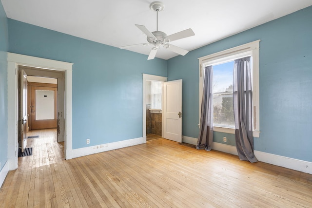 unfurnished bedroom with ceiling fan and light wood-type flooring