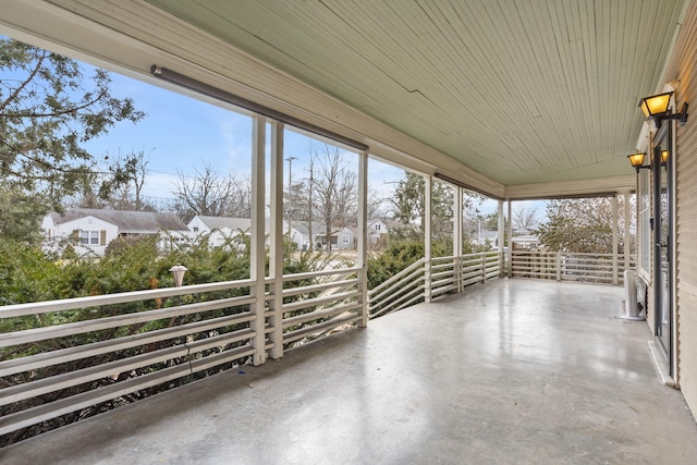 unfurnished sunroom with a wealth of natural light