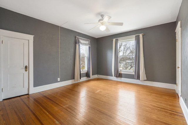 unfurnished room with ceiling fan and light hardwood / wood-style floors