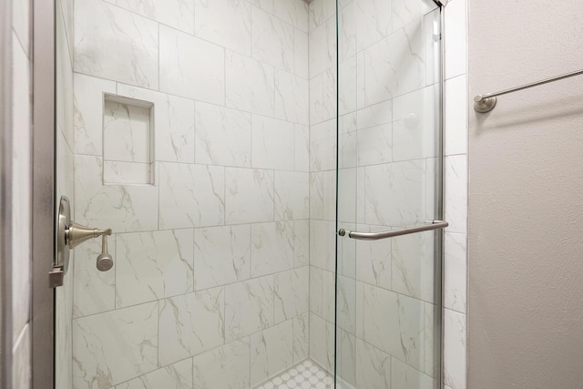 bathroom featuring walk in shower