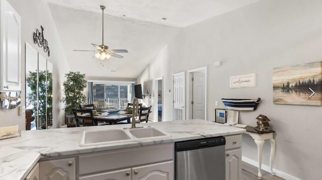 31 Golfshores Dr Unit 19, Branson, MO 65616 - kitchen with light stone counters, sink, stainless steel dishwasher, and ceiling fan