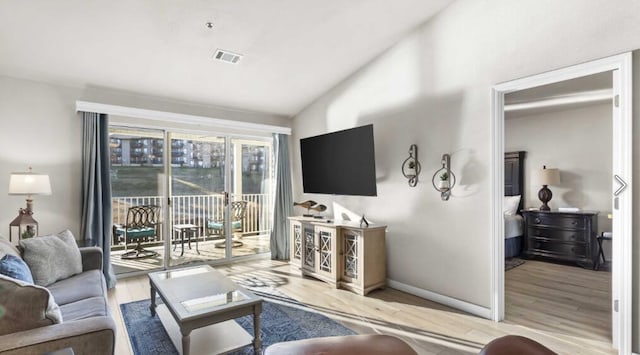 31 Golfshores Dr Unit 19, Branson, MO 65616 - living room with vaulted ceiling and light wood-type flooring