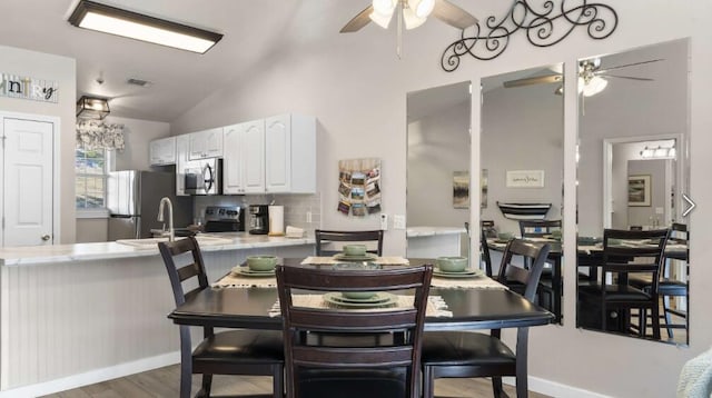 31 Golfshores Dr Unit 19, Branson, MO 65616 - dining area featuring ceiling fan, lofted ceiling, sink, and dark hardwood / wood-style flooring
