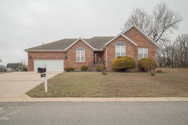 ranch-style home featuring brick siding, driveway, an attached garage, and a front lawn