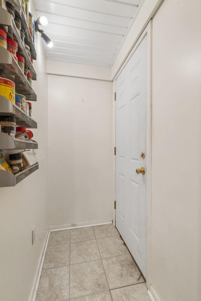 entryway with light tile patterned floors