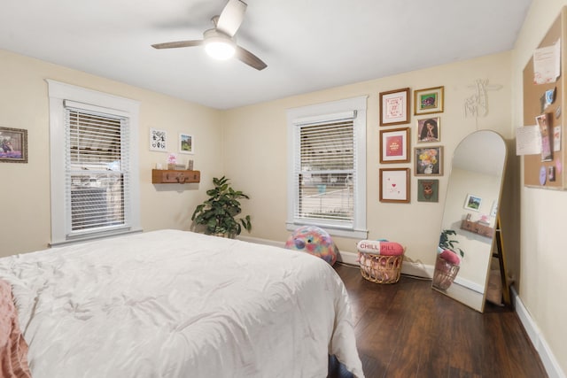 bedroom featuring dark hardwood / wood-style flooring and ceiling fan