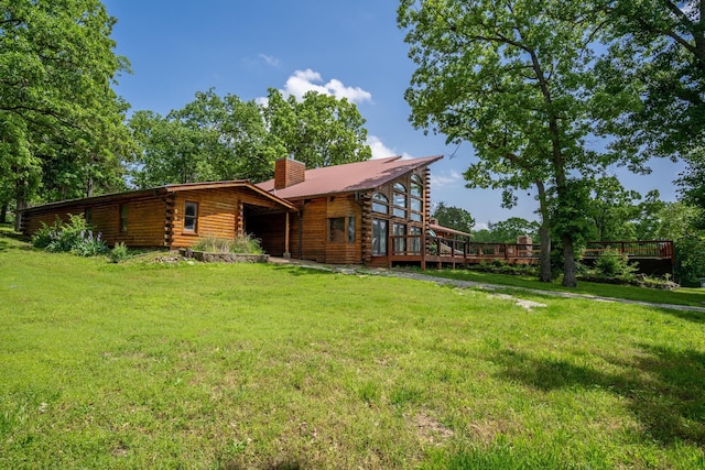 241 Nine Center Ct, Reeds Spring, MO 65737 - rear view of house with log siding, a chimney, and a yard