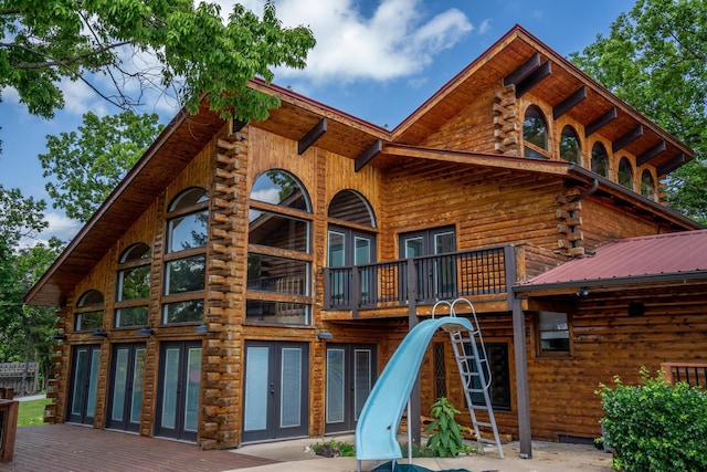 241 Nine Center Ct, Reeds Spring, MO 65737 - rear view of property featuring log siding and a deck