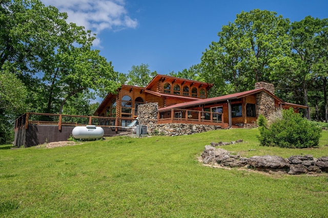 241 Nine Center Ct, Reeds Spring, MO 65737 - rear view of house featuring a lawn and a chimney