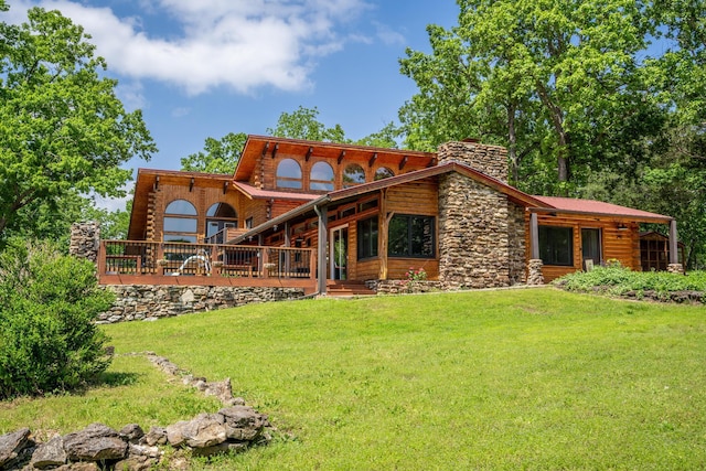 241 Nine Center Ct, Reeds Spring, MO 65737 - rear view of property featuring a lawn, a chimney, stone siding, and log exterior