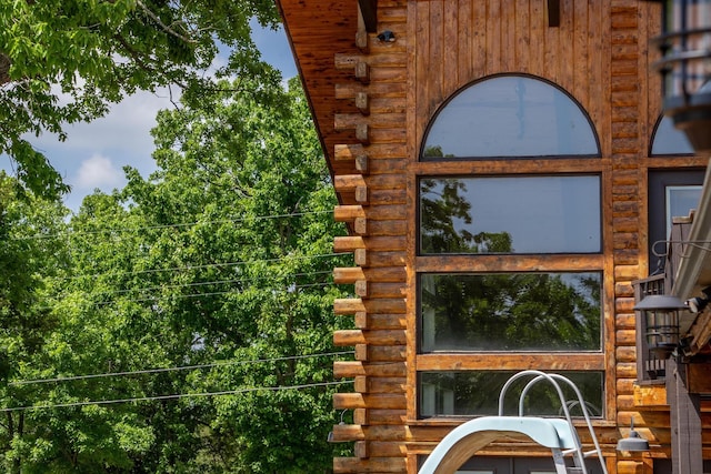 241 Nine Center Ct, Reeds Spring, MO 65737 - exterior view of log siding