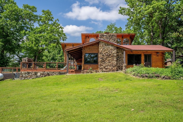 241 Nine Center Ct, Reeds Spring, MO 65737 - back of house with stone siding, a yard, and a wooden deck