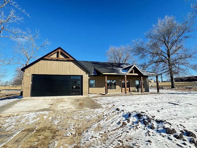 view of front of property with a garage and covered porch