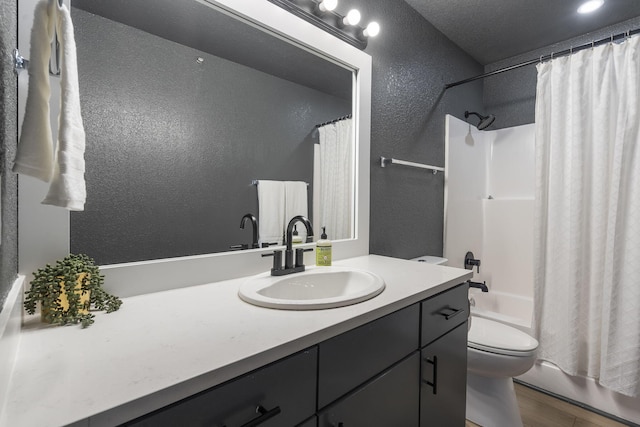 full bathroom featuring vanity, toilet, wood-type flooring, and shower / bath combo