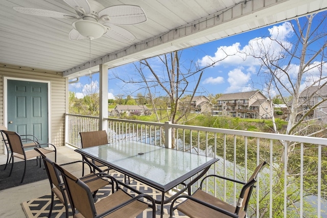 exterior space with a water view and ceiling fan