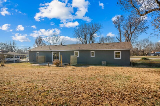 back of property featuring a patio area, fence, central AC, and a lawn