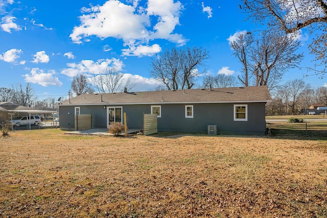 back of house with a yard, a patio, cooling unit, and fence