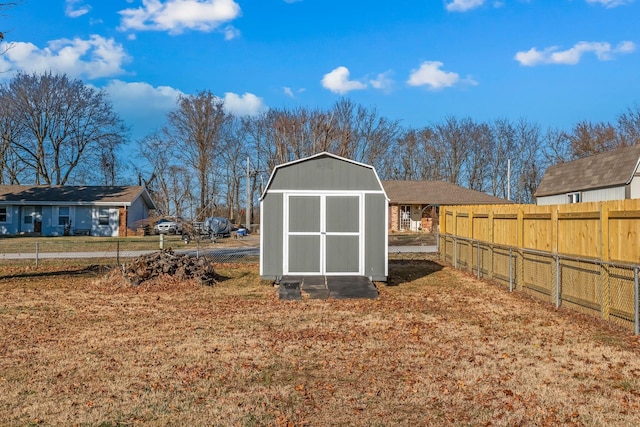 view of shed with fence