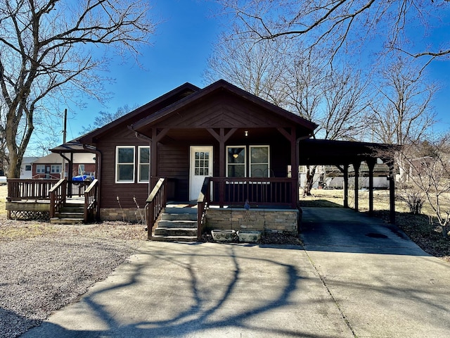 view of front of property with a carport and a porch