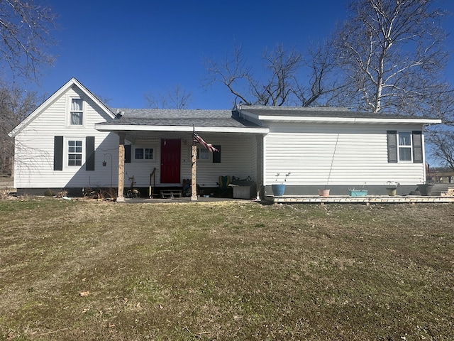 back of house featuring a yard