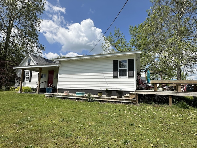 rear view of property with a yard and crawl space