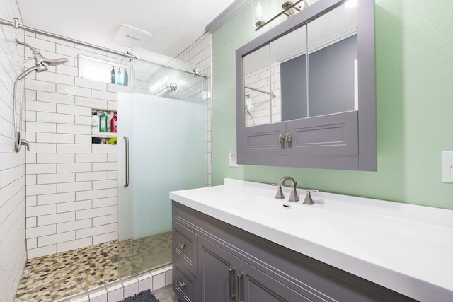 bathroom with an enclosed shower and vanity