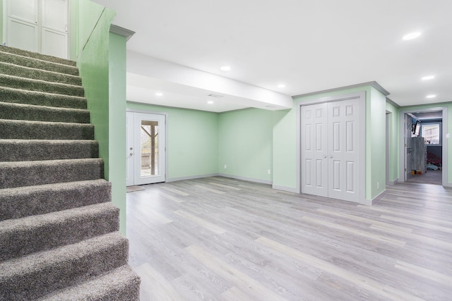 basement featuring light hardwood / wood-style flooring