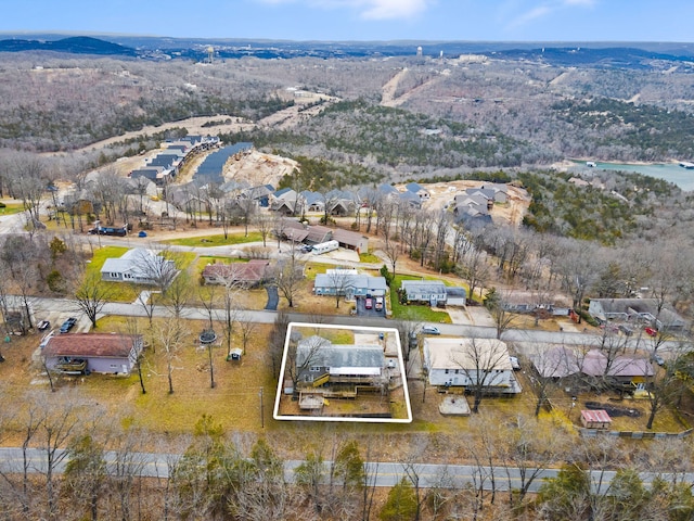 aerial view featuring a water and mountain view