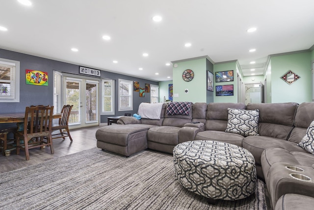 living room with hardwood / wood-style flooring and ornamental molding