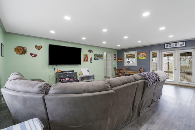 living room with wood-type flooring, crown molding, and french doors