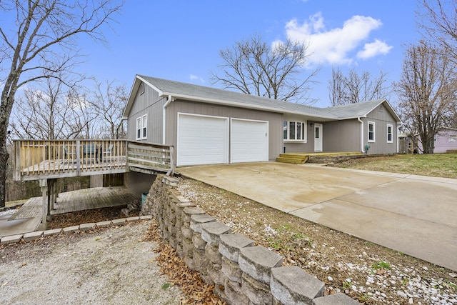 view of front of property with a wooden deck and a garage