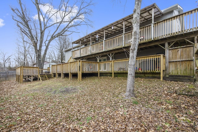 rear view of property with a wooden deck