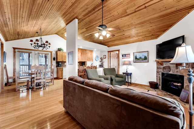 living room featuring light hardwood / wood-style flooring, ceiling fan with notable chandelier, wooden ceiling, a fireplace, and high vaulted ceiling