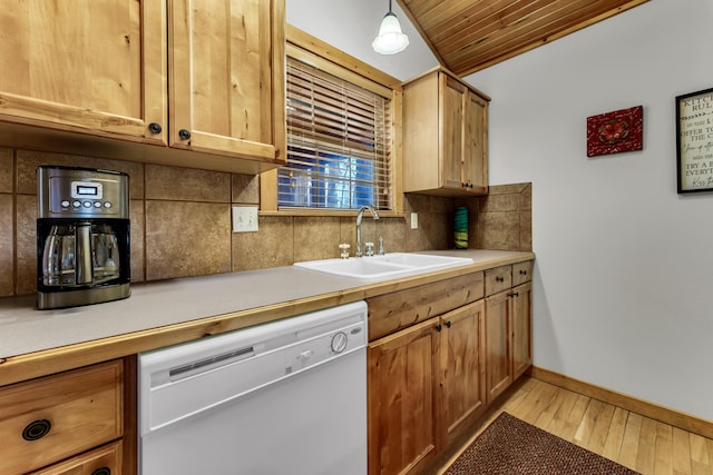 kitchen with light hardwood / wood-style flooring, sink, backsplash, decorative light fixtures, and white dishwasher