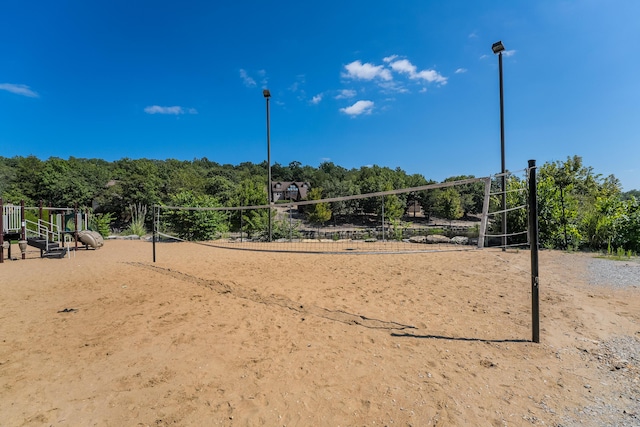 view of home's community featuring a playground and volleyball court