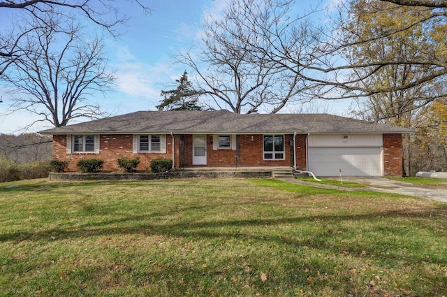 ranch-style home featuring a garage and a front yard