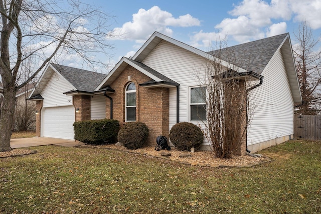 view of front of home with a garage and a front yard