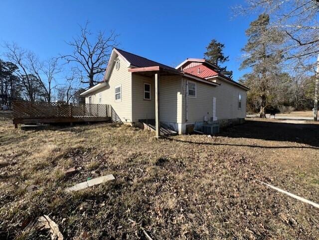 view of side of property with cooling unit