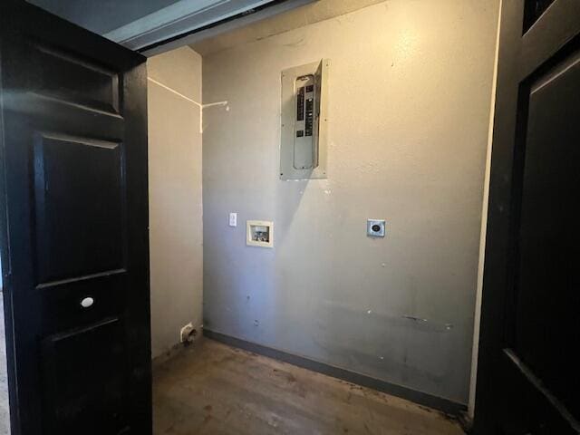 clothes washing area with electric dryer hookup, hookup for a washing machine, and electric panel