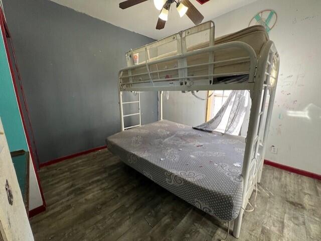 bedroom with hardwood / wood-style flooring and ceiling fan