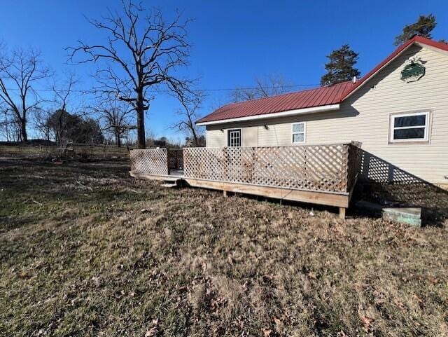 rear view of house with a yard